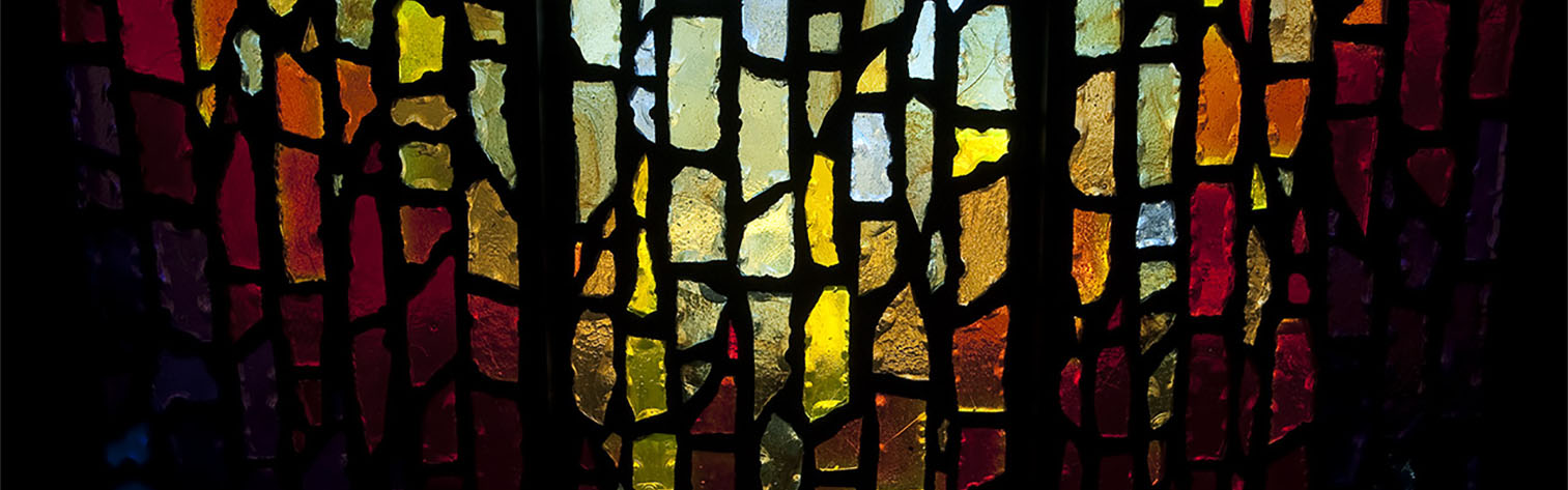 Photo of a stained glass window in a chapel at University of Portland.