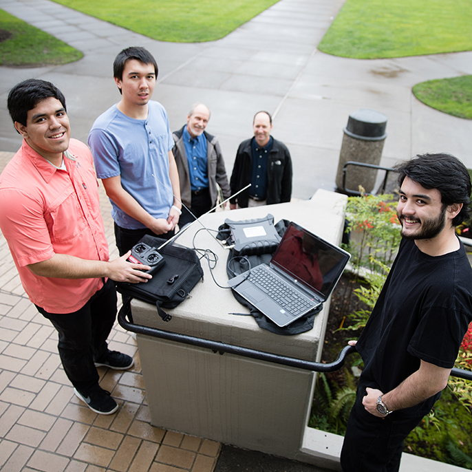 students posing with equipment