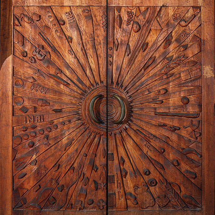 chapel doors carved with religious icons