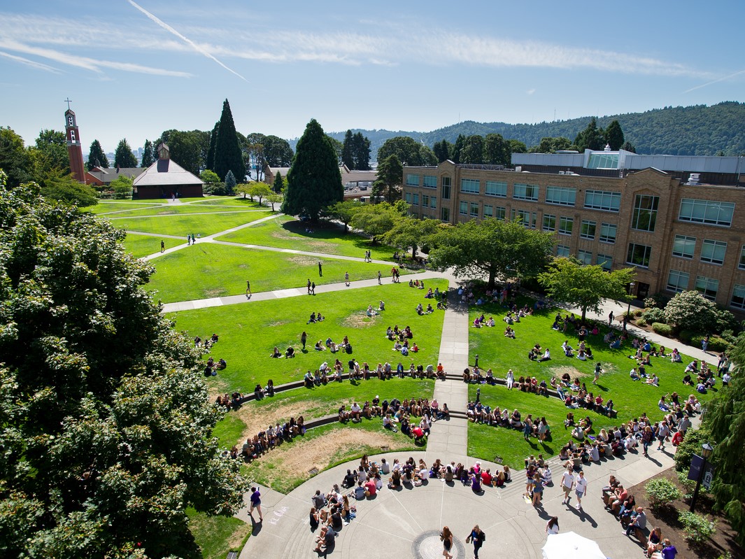 An aerial image of the campus quad filled with students