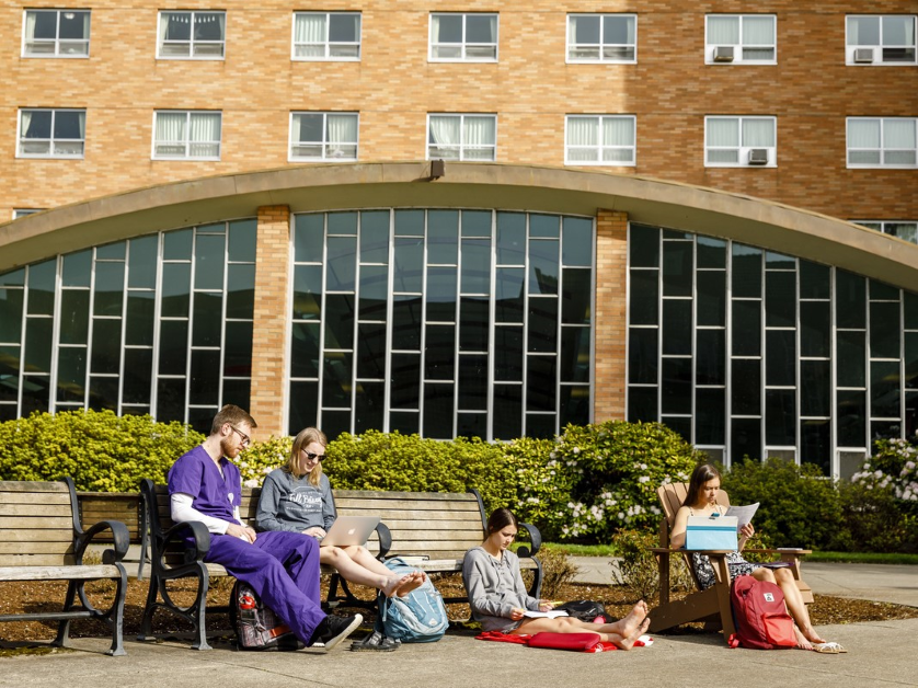 Students socializing outside Corrado hall