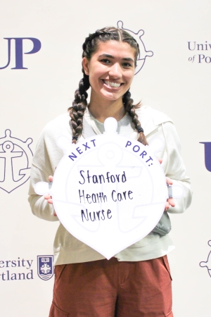 Julia Rocha posing with Next Port sign.