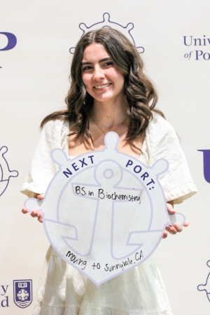 Maggie Batek posing with Next Port sign.