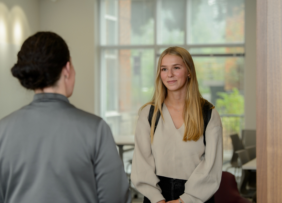 Student interacting with employee at the Career Education Center