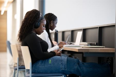 Student on laptop in a classroom