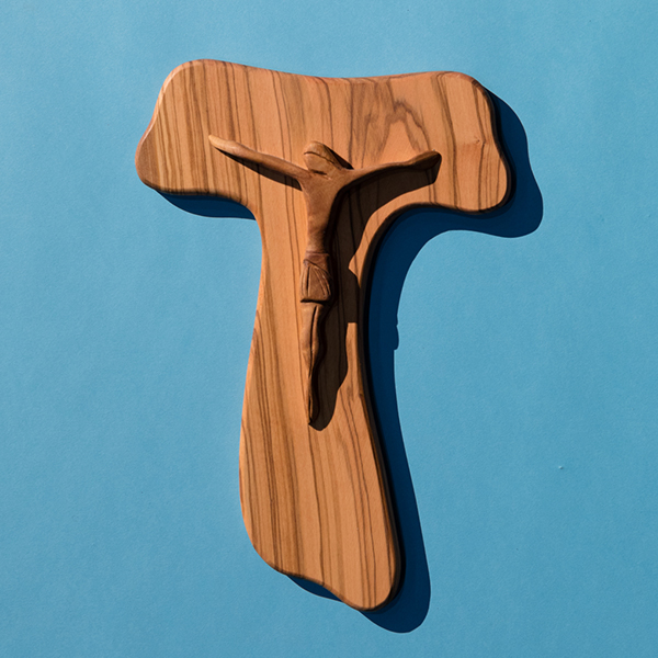 wooden cross on blue background