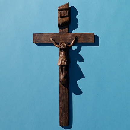 wooden cross on blue background