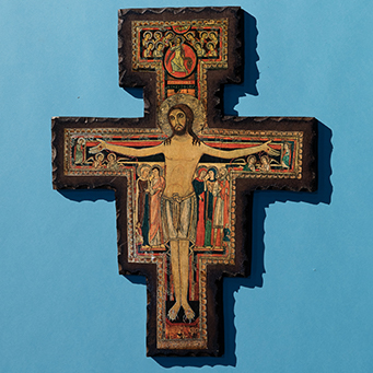 wooden cross on blue background