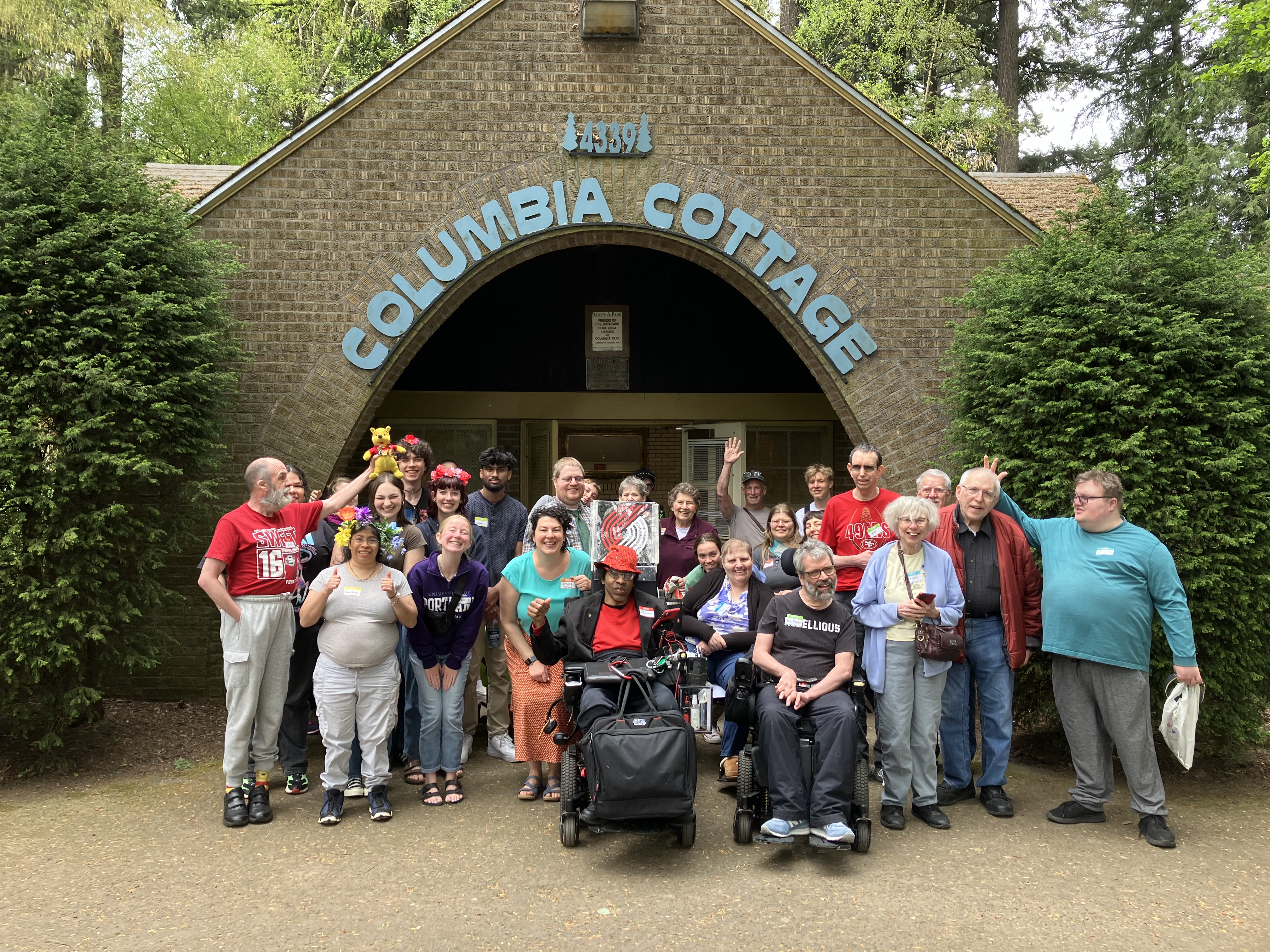 a group of L'Arche community members at the Spring picnic outside columbia park cottage