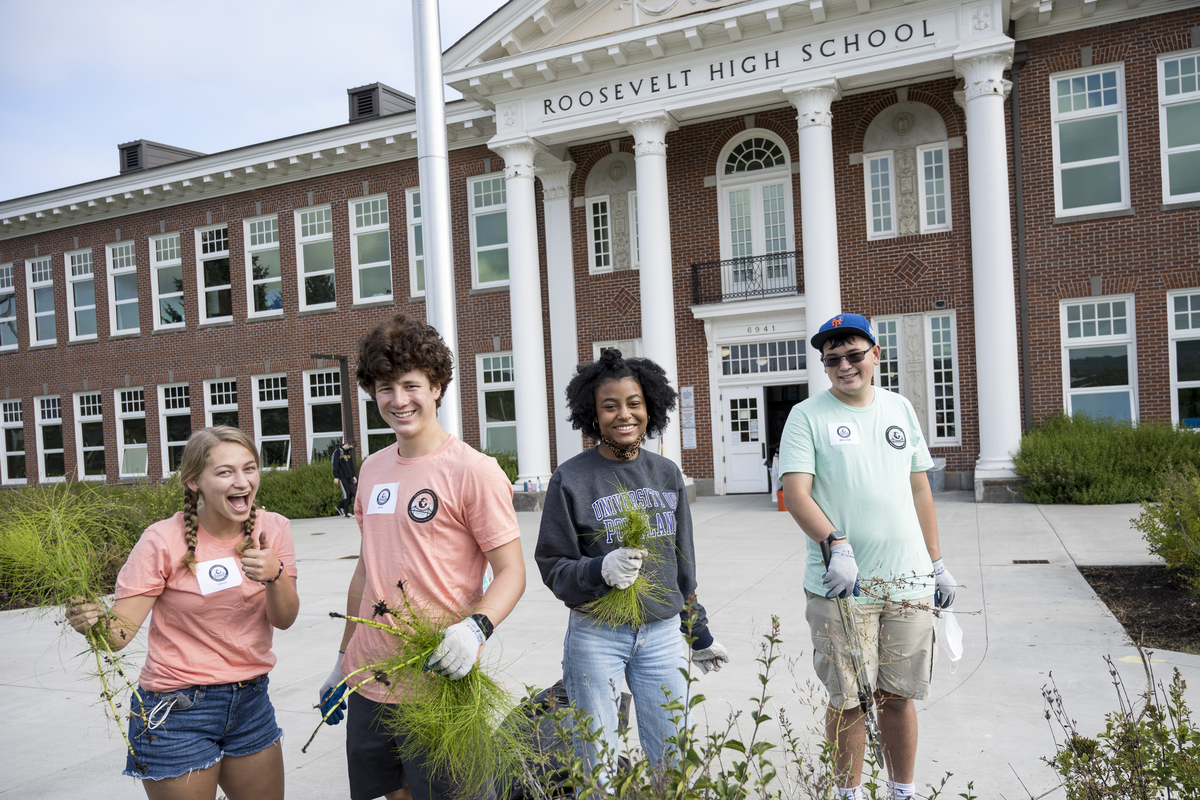 Students standing in front of roosevelt high school
