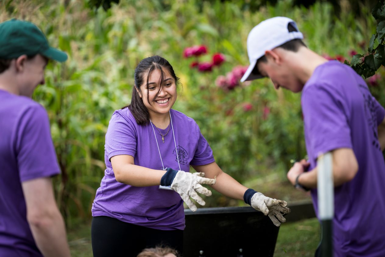 Students volunteer in a garden