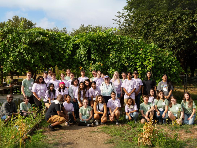 A group photo of volunteers in a community garden