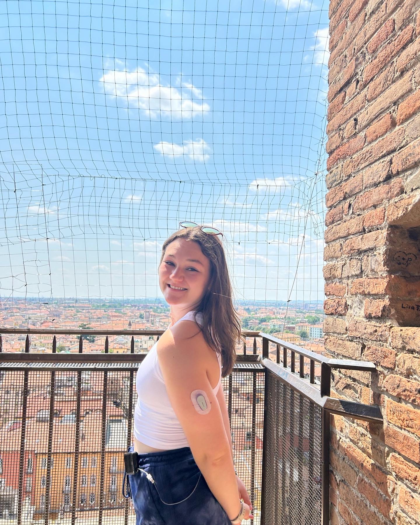 sophie standing in front of buildings