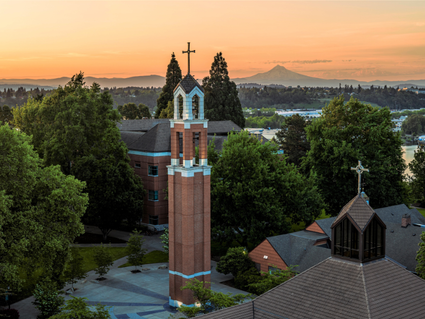 An aerial image of the campus belltower at sunset