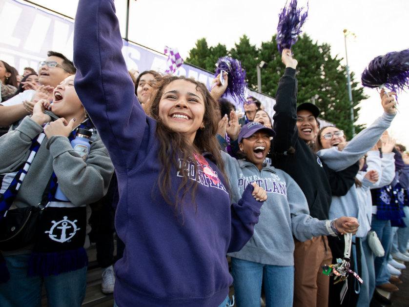 Students cheer at a soccer game