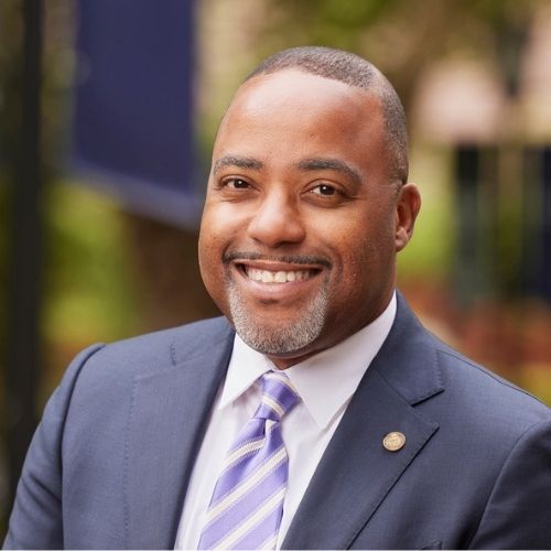 A portrait image of Robert Kelly smiling