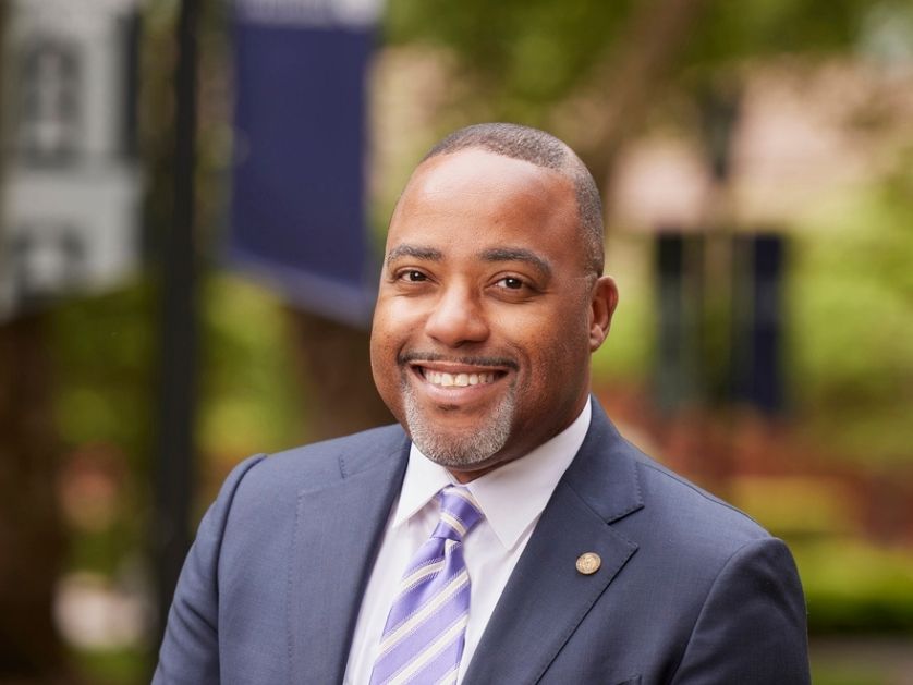 A portrait image of Robert Kelly smiling