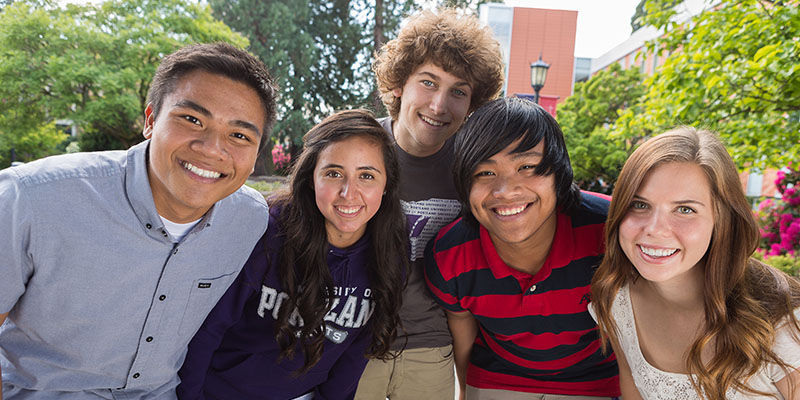 five students posing outside