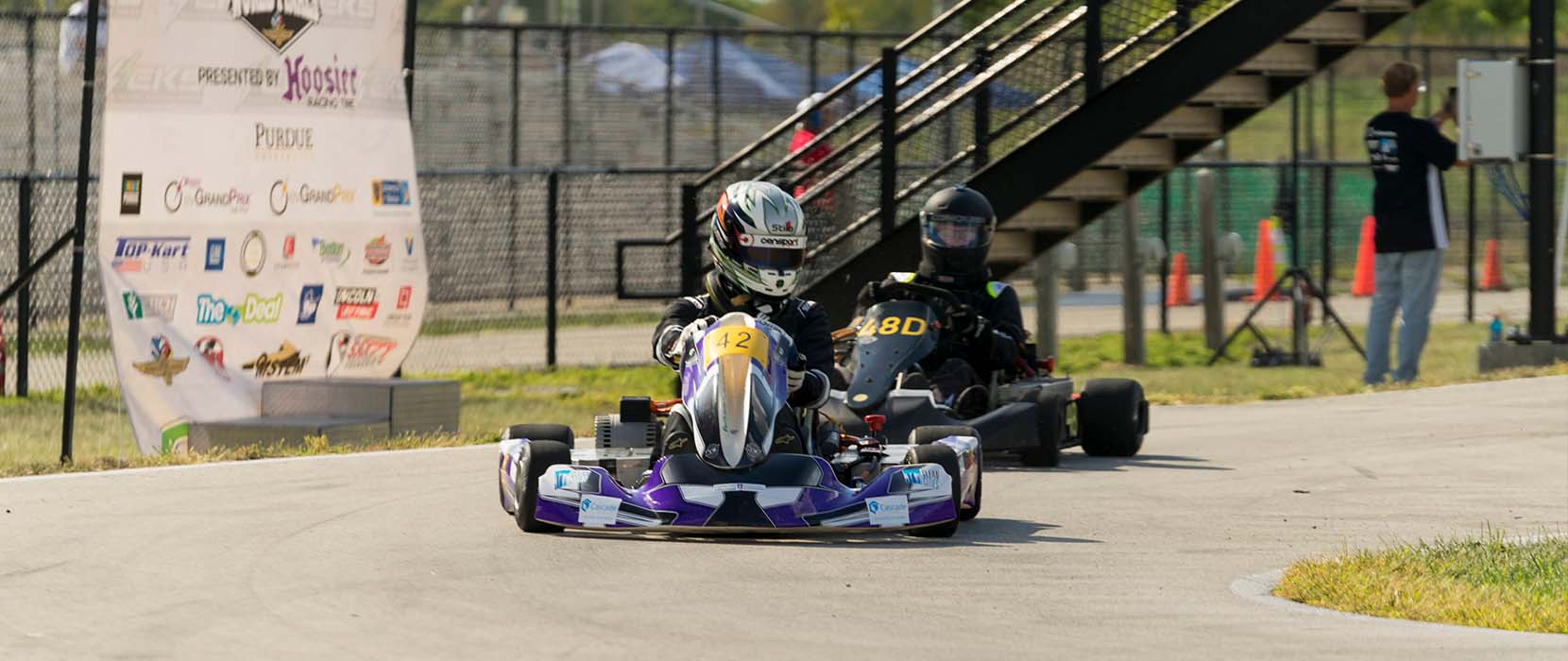 Car racing around track.