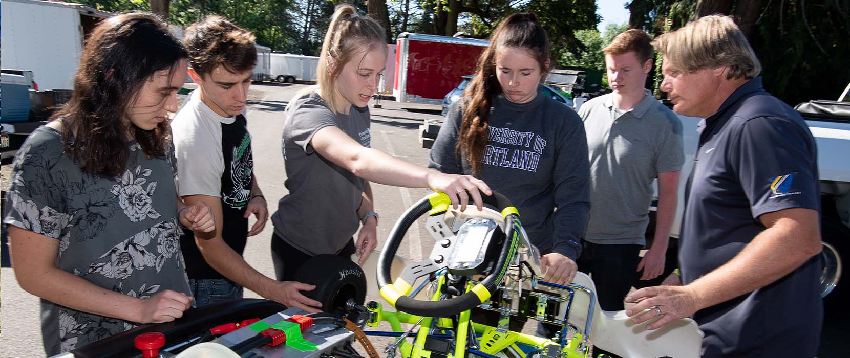 Team working on car.