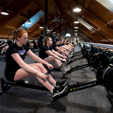 The crew team works on the rowing machines