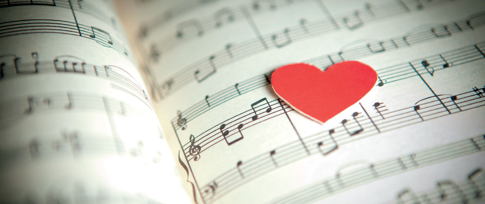 Sheet music with a red heart