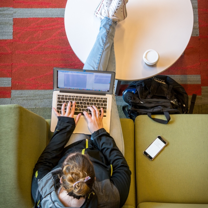 Overhead view of person working in a library