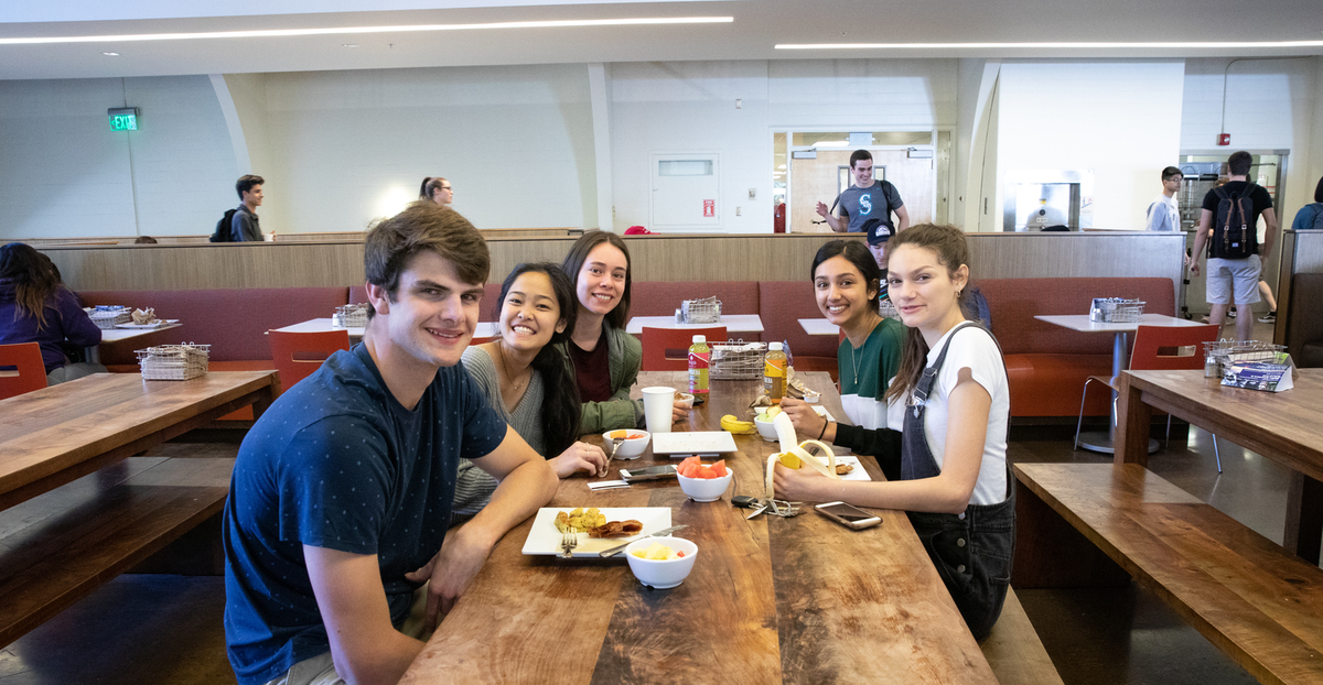 students eating in the commons